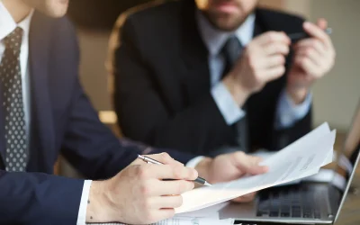 successful-business-partners-discussing-contract
